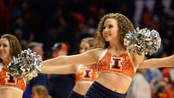 CHAMPAIGN, IL - FEBRUARY 22: An Illinois Fighting Illini cheerleader performs during a timeout in the Big Ten Conference college basketball game between the Purdue Boilermakers and the Illinois Fighting Illini on February 22, 2018, at the State Farm Center in Champaign, Illinois. (Photo by Michael Allio/Icon Sportswire via Getty Images)