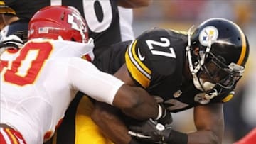 Aug 24, 2013; Pittsburgh, PA, USA; Pittsburgh Steelers running back Jonathan Dwyer (27) carries the ball against Kansas City Chiefs outside linebacker Justin Houston (50) during the first quarter at Heinz Field. Mandatory Credit: Charles LeClaire-USA TODAY Sports
