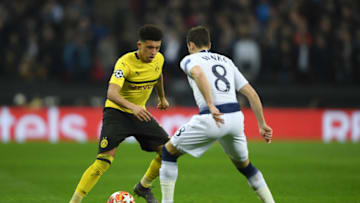 LONDON, ENGLAND - FEBRUARY 13: Jadon Sancho of Borussia Dortmund is challenged by Harry Winks of Tottenham Hotspur during the UEFA Champions League Round of 16 First Leg match between Tottenham Hotspur and Borussia Dortmund at Wembley Stadium on February 13, 2019 in London, England. (Photo by Mike Hewitt/Getty Images)