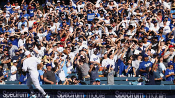 LOS ANGELES, CALIFORNIA - AUGUST 24: A general view of the fans looking for the foul ball is seen during the ninth inning of the MLB game between the New York Yankees and the Los Angeles Dodgers at Dodger Stadium on August 24, 2019 in Los Angeles, California. Teams are wearing special color-schemed uniforms with players choosing nicknames to display for Players' Weekend. The Dodgers defeated the Yankees 2-1. (Photo by Victor Decolongon/Getty Images)