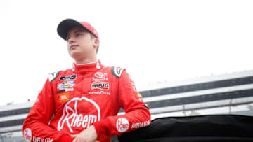 DOVER, DE - OCTOBER 06: Christopher Bell, driver of the #20 Rheem Toyota, stands on the grid during qualifying for the NASCAR Xfinity Series Bar Harbor 200 presented by Sea Watch International at Dover International Speedway on October 6, 2018 in Dover, Delaware. (Photo by Chris Trotman/Getty Images)
