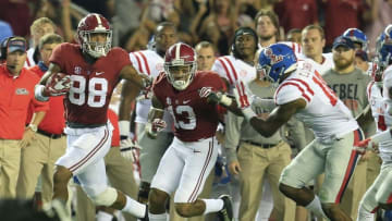Sep 19, 2015; Tuscaloosa, AL, USA; Alabama Crimson Tide tight end O.J. Howard (88) carries the ball as Alabama Crimson Tide wide receiver ArDarius Stewart (13) blocks for him during the game against the Mississippi Rebels at Bryant-Denny Stadium. Mandatory Credit: Marvin Gentry-USA TODAY Sports