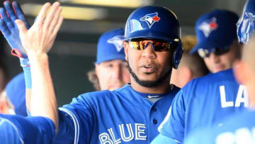 Jun 29, 2016; Denver, CO, USA; Toronto Blue Jays designated hitter Edwin Encarnacion (10) celebrates scoring a run in the third inning against the Colorado Rockies at Coors Field. Mandatory Credit: Ron Chenoy-USA TODAY Sports