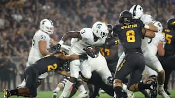 TEMPE, AZ - SEPTEMBER 08: Running back LJ Scott #3 of the Michigan State Spartans rushes the football past defensive back Demonte King #28 of the Arizona State Sun Devils during the college football game at Sun Devil Stadium on September 8, 2018 in Tempe, Arizona. The Sun Devils defeated the Spartans 16-13. (Photo by Christian Petersen/Getty Images)