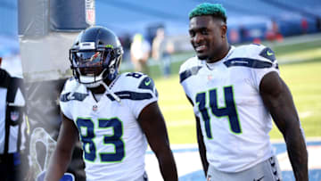 ORCHARD PARK, NEW YORK - NOVEMBER 08: David Moore #83 and DK Metcalf #14 of the Seattle Seahawks walk off the field during a game against the Buffalo Bills at Bills Stadium on November 08, 2020 in Orchard Park, New York. (Photo by Bryan Bennett/Getty Images)
