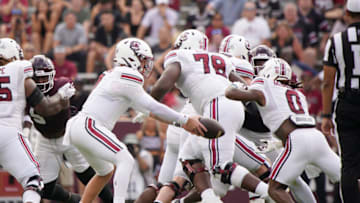 South Carolina football's Spencer Rattler hands off to Juju McDowell during the Gamecocks' loss to Texas A&M. Mandatory Credit: Dustin Safranek-USA TODAY Sports