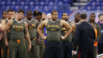 INDIANAPOLIS, IN - FEBRUARY 22: A group of offensive linemen listen to instruction during the 2014 NFL Combine at Lucas Oil Stadium on February 22, 2014 in Indianapolis, Indiana. (Photo by Joe Robbins/Getty Images)