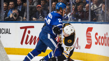 TORONTO, ON - APRIL 23: Kasperi Kapanen #24 of the Toronto Maple Leafs checks Charlie McAvoy #73 of the Boston Bruins in Game Six of the Eastern Conference First Round during the 2018 NHL Stanley Cup Playoffs at the Air Canada Centre on April 23, 2018 in Toronto, Ontario, Canada. (Photo by Mark Blinch/NHLI via Getty Images)