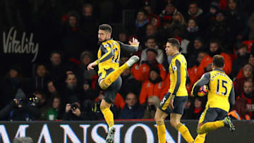 BOURNEMOUTH, ENGLAND - JANUARY 03: Olivier Giroud (1st L) of Arsenal celebrates scoring his team's third goal during the Premier League match between AFC Bournemouth and Arsenal at Vitality Stadium on January 3, 2017 in Bournemouth, England. (Photo by Warren Little/Getty Images)