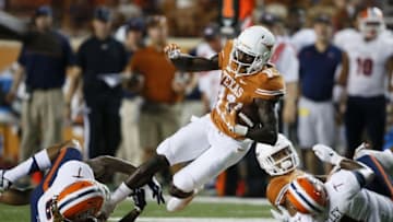 Sep 10, 2016; Austin, TX, USA; Texas Longhorns wide receiver Jacorey Warrick (11) gains yardage against University of Texas at El Paso Miners defensive back Brandon Moss (6) in the fourth quarter at Darrell K Royal-Texas Memorial Stadium. Mandatory Credit: Erich Schlegel-USA TODAY Sports