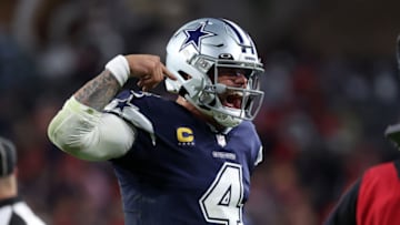 Jan 16, 2023; Tampa, Florida, USA; Dallas Cowboys quarterback Dak Prescott (4) reacts after throwing a touchdown pass against the Tampa Bay Buccaneers in the second half during the wild card game at Raymond James Stadium. Mandatory Credit: Kim Klement-USA TODAY Sports