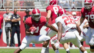 Apr 19, 2014; Tuscaloosa, AL, USA; Alabama Crimson Tide running back T.J. Yeldon (4) carries the ball for the red team during the A-Day game at Bryant-Denny Stadium. Mandatory Credit: Marvin Gentry-USA TODAY Sports
