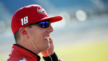 JOLIET, IL - JUNE 30: Kyle Busch, driver of the #18 Skittles Red White & Blue Toyota, looks on from the grid during qualifying for the Monster Energy NASCAR Cup Series Overton's 400 at Chicagoland Speedway on June 30, 2018 in Joliet, Illinois. (Photo by Dylan Buell/Getty Images)