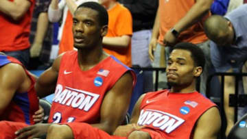 Mar 29, 2014; Memphis, TN, USA; Dayton Flyers forward Dyshawn Pierre (left) and Dayton Flyers guard Vee Sanford (right) reacts during the second half in the finals of the south regional of the 2014 NCAA Mens Basketball Championship tournament against the Florida Gators at FedEx Forum. Florida won 62-52. Mandatory Credit: Spruce Derden-USA TODAY Sports