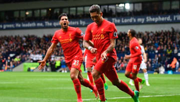 Liverpool's Brazilian midfielder Roberto Firmino (R) celebrates scoring the opening goal with Liverpool's German midfielder Emre Can during the English Premier League football match between West Bromwich Albion and Liverpool at The Hawthorns stadium in West Bromwich, central England, on April 16, 2017. / AFP PHOTO / Justin TALLIS / RESTRICTED TO EDITORIAL USE. No use with unauthorized audio, video, data, fixture lists, club/league logos or 'live' services. Online in-match use limited to 75 images, no video emulation. No use in betting, games or single club/league/player publications. / (Photo credit should read JUSTIN TALLIS/AFP/Getty Images)