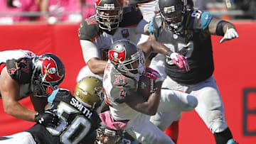 Oct 11, 2015; Tampa, FL, USA; Tampa Bay Buccaneers running back Charles Sims (34) dives for a first down during the second half of an NFL football game against the Jacksonville Jaguars at Raymond James Stadium. Tampa won 38-31. Mandatory Credit: Reinhold Matay-USA TODAY Sports