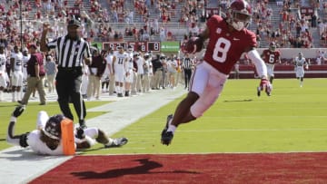 Oct 3, 2020; Tuscaloosa, Alabama, USA; Alabama wide receiver John Metchie III (8) floats into the end zone with a touchdown after catching a pass from Alabama quarterback Mac Jones (10) and scoring against Texas A&M at Bryant-Denny Stadium. Alabama defeated A&M 52-24. Mandatory Credit: Gary Cosby Jr/The Tuscaloosa News via USA TODAY Sports