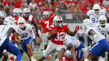 Ohio State Buckeyes running back TreVeyon Henderson (32) slices through the Tulsa Golden Hurricane defense on his way to scoring a 52-yard touchdown during the third quarter of the NCAA football game at Ohio Stadium in Columbus on Saturday, Sept. 18, 2021.Tulsa At Ohio State Football