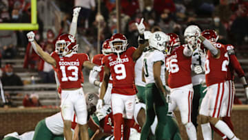 Dec 5, 2020; Norman, Oklahoma, USA; Oklahoma Sooners defensive back Tre Norwood (13) and cornerback D.J. Graham (9) react during the first half against the Baylor Bears at Gaylord Family-Oklahoma Memorial Stadium. Mandatory Credit: Kevin Jairaj-USA TODAY Sports