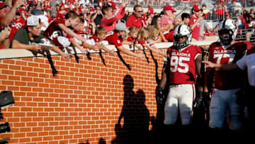 Fans cheer as Oklahoma players get ready to take the field for warm ups before a college football game between the University of Oklahoma Sooners (OU) and the West Virginia Mountaineers at Gaylord Family-Oklahoma Memorial Stadium in Norman, Okla., Saturday, Sept. 25, 2021.J6p1202