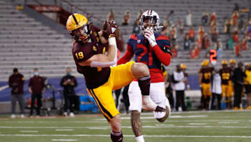 TUCSON, ARIZONA - DECEMBER 11: Wide receiver Ricky Pearsall #19 of the Arizona State Sun Devils catches a 31-yard touchdown reception past defensive back #21 of the Arizona Wildcats during the first half of the NCAAF game at Arizona Stadium on December 11, 2020 in Tucson, Arizona. This years game is the 94th contest of the Territorial Cup. (Photo by Christian Petersen/Getty Images)