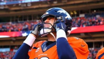 Jan 17, 2016; Denver, CO, USA; Denver Broncos quarterback Peyton Manning (18) puts his helmet on prior to the AFC Divisional round playoff game against the Pittsburgh Steelers at Sports Authority Field at Mile High. Mandatory Credit: Mark J. Rebilas-USA TODAY Sports