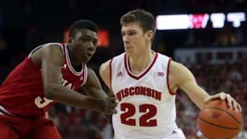 Jan 26, 2016; Madison, WI, USA; Wisconsin Badgers forward Ethan Happ (22) moves the ball against Indiana Hoosiers forward OG Anunoby (3) at the Kohl Center. Wisconsin defeated Indiana 82-79 (OT). Mandatory Credit: Mary Langenfeld-USA TODAY Sports