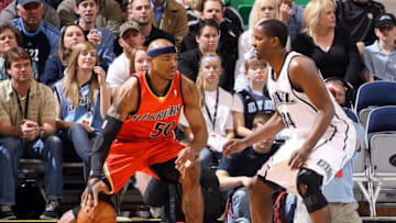 SALT LAKE CITY - MARCH 31: Corey Maggette #50 of the Golden State Warriors moves the ball against C.J. Miles #34 of the Utah Jazz during the game at the EnergySolutions Arena on March 31, 2010 in Salt Lake City, Utah. The Jazz won 128-104. NOTE TO USER: User expressly acknowledges and agrees that, by downloading and/or using this Photograph, user is consenting to the terms and conditions of the Getty Images License Agreement. Mandatory Copyright Notice: Copyright 2010 NBAE (Photo by Melissa Majchrzak/NBAE via Getty Images)