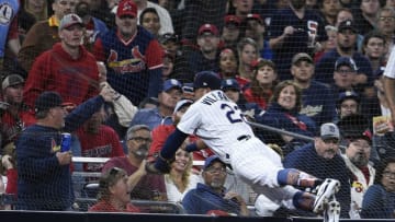 SAN DIEGO, CA - MAY 12: Christian Villanueva #22 of the San Diego Padres crashes into the net as he chases a foul ball hit by Dexter Fowler #25 of the St. Louis Cardinals during the eighth inning of a baseball game at PETCO Park on May 12, 2018 in San Diego, California. Villanueva was unable to make the catch. (Photo by Denis Poroy/Getty Images)