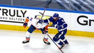 EDMONTON, ALBERTA - SEPTEMBER 07: Scott Mayfield #24 of the New York Islanders is checked by Alex Killorn #17 of the Tampa Bay Lightning during the third period in Game One of the Eastern Conference Final during the 2020 NHL Stanley Cup Playoffs at Rogers Place on September 07, 2020 in Edmonton, Alberta, Canada. (Photo by Bruce Bennett/Getty Images)