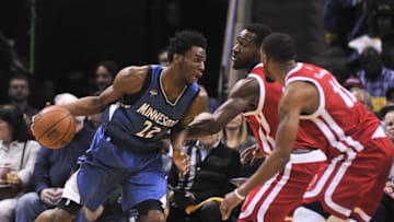 Feb 19, 2016; Memphis, TN, USA; Minnesota Timberwolves guard Andrew Wiggins (22) goes to the basket against Memphis Grizzlies guard Tony Allen (9) and Memphis Grizzlies guard Mike Conley (11) during the first quarter at FedExForum. Mandatory Credit: Justin Ford-USA TODAY Sports