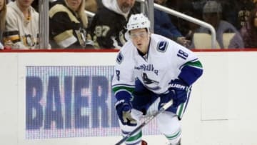 Jan 23, 2016; Pittsburgh, PA, USA; Vancouver Canucks right wing Jake Virtanen (18) skates with the puck against the Pittsburgh Penguins during the third period at the CONSOL Energy Center. The Penguins won 5-4. Mandatory Credit: Charles LeClaire-USA TODAY Sports