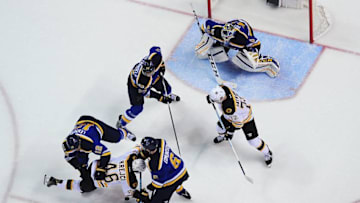 Jan 10, 2017; St. Louis, MO, USA; Boston Bruins center David Krejci (46) collides with St. Louis Blues defenseman Joel Edmundson (6) as center Jori Lehtera (12) defenseman Alex Pietrangelo (27) and goalie Carter Hutton (40) defend the net against center Frank Vatrano (72) during the second period at Scottrade Center. The Bruins won 5-3. Mandatory Credit: Jeff Curry-USA TODAY Sports