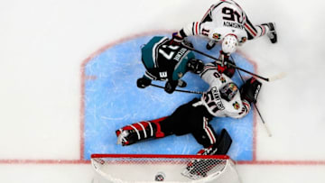 ANAHEIM, CA - DECEMBER 05: Corey Crawford #50 and Artem Anisimov #15 of the Chicago Blackhawks defend against Nick Ritchie #37 of the Anaheim Ducks during the second period of a game at Honda Center on December 5, 2018 in Anaheim, California. (Photo by Sean M. Haffey/Getty Images)
