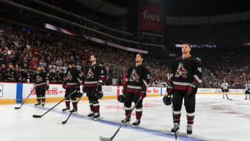 GLENDALE, ARIZONA - OCTOBER 05: Michael Grabner #40, Vinnie Hinostroza #13, Oliver Ekman-Larsson #23, Jason Demers #55 and Brad Richardson #15 of the Arizona Coyotes stand on the blue line before the singing of the national anthem prior to a game against the Boston Bruins at Gila River Arena on October 05, 2019 in Glendale, Arizona. (Photo by Norm Hall/NHLI via Getty Images)