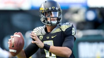 Nov 1, 2014; Eugene, OR, USA; Oregon Ducks quarterback Marcus Mariota (8) throws the ball before the game against the Stanford Cardinal at Autzen Stadium. Mandatory Credit: Scott Olmos-USA TODAY Sports