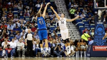 Dec 4, 2013; New Orleans, LA, USA; Dallas Mavericks power forward Dirk Nowitzki (41) shoots over New Orleans Pelicans center Jason Smith (14) during the second quarter of a game at New Orleans Arena. Mandatory Credit: Derick E. Hingle-USA TODAY Sports