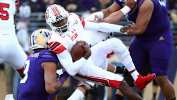 SEATTLE, WASHINGTON - NOVEMBER 02: Tyler Huntley #1 of the Utah Utes is sacked by Joe Tryon #9 of the Washington Huskies in the first quarter during their game at Husky Stadium on November 02, 2019 in Seattle, Washington. (Photo by Abbie Parr/Getty Images)