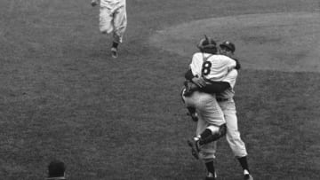 NEW YORK - OCTOBER 8: Pitcher Don Larsen (r), of the New York Yankees, wraps his arms around catcher Yogi Berra #8 after the final pitch of Game 5 of the 1956 World Series against the Brooklyn Dodgers at Yankee Stadium in New York. Larsen pitched the first perfect game in World Series history as the Yankees defeated Sal Maglie and the Dodgers, 2-0.(Photo by: Diamond Images/Getty Images)