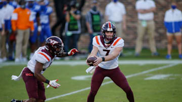 Oct 3, 2020; Durham, North Carolina, USA; Virginia Tech Hokies quarterback Braxton Burmeister (3) prepares to hand off to Virginia Tech Hokies running back Raheem Blackshear, left, against the Duke Blue Devils in the second half at Wallace Wade Stadium. The Virginia Tech Hokies won 38-31. Mandatory Credit: Nell Redmond-USA TODAY Sports