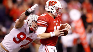 INDIANAPOLIS, IN - DECEMBER 02: Alex Hornibrook #12 of the Wisconsin Badgers is sacked by Nick Bosa #97 of the Ohio State Buckeyes in the Big Ten Championship at Lucas Oil Stadium on December 2, 2017 in Indianapolis, Indiana. (Photo by Andy Lyons/Getty Images)