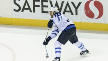 Apr 7, 2016; San Jose, CA, USA; Winnipeg Jets defenseman Dustin Byfuglien (33) shoots and scores a goal against the San Jose Sharks in the last ten seconds of the game in the third period at SAP Center at San Jose. Winnipeg won 5-4. Mandatory Credit: John Hefti-USA TODAY Sports