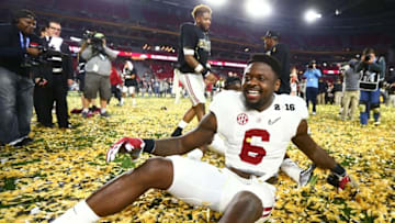 Jan 11, 2016; Glendale, AZ, USA; Alabama Crimson Tide defensive back Hootie Jones (6) celebrates by sliding through confetti on the field after defeating the Clemson Tigers in the 2016 CFP National Championship at University of Phoenix Stadium. Mandatory Credit: Mark J. Rebilas-USA TODAY Sports