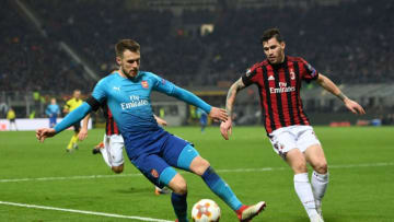MILAN, ITALY - MARCH 08: Aaron Ramsey of Arsenal is closed down by Alessio Romagnoli of AC Milan during UEFA Europa League Round of 16 match between AC Milan and Arsenal at the San Siro on March 8, 2018 in Milan, Italy. (Photo by David Price/Arsenal FC via Getty Images)