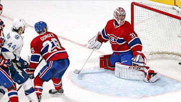 Feb 1, 2014; Montreal, Quebec, CAN; Tampa Bay Lightning center Nate Thompson (44) scores a goal against Montreal Canadiens goalie Carey Price (31) as defenseman Josh Gorges (26) defends during the over time period at Bell Centre. Mandatory Credit: Jean-Yves Ahern-USA TODAY Sports
