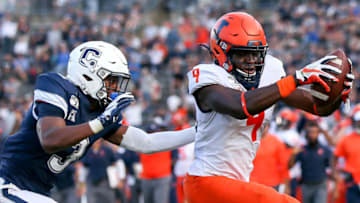 EAST HARTFORD, CT - SEPTEMBER 07: Illinois Fighting Illini wide receiver Josh Imatorbhebhe (9) reaches over the goal line for a touchdown against UConn Huskies defensive back Diamond Harrell (3) during the game between the Illinois Fighting Illini and the UConn Huskies played on September 07, 2019 at Pratt & Whitney Stadium in East Hartford, CT. (Photo by Steve Nurenberg/Icon Sportswire via Getty Images)