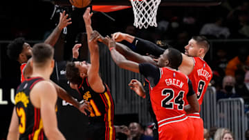 Dec 27, 2021; Atlanta, Georgia, USA; Atlanta Hawks guard Trae Young (11) and center Clint Capela (15) battle for a rebound with Chicago Bulls forward Javonte Green (24) and center Nikola Vucevic (9) during the second half at State Farm Arena. Mandatory Credit: Dale Zanine-USA TODAY Sports