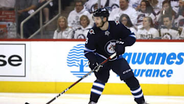 WINNIPEG, MB - MAY 12: Jacob Trouba #8 of the Winnipeg Jets carries the puck against the Vegas Golden Knights during the first period in Game One of the Western Conference Finals during the 2018 NHL Stanley Cup Playoffs at Bell MTS Place on May 12, 2018 in Winnipeg, Canada. (Photo by Elsa/Getty Images)