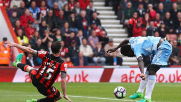 BOURNEMOUTH, ENGLAND - MAY 06: Mame Biram Diouf of Stoke City scores his sides second goal as Adam Smith of AFC Bournemouth attempts to block during the Premier League match between AFC Bournemouth and Stoke City at the Vitality Stadium on May 6, 2017 in Bournemouth, England. (Photo by Ian Walton/Getty Images)