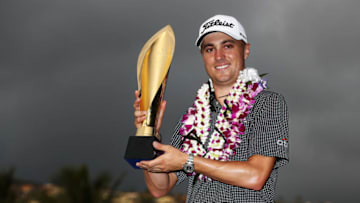 HONOLULU, HI - JANUARY 15: Justin Thomas of the United States celebrates with the trophy after winning the Sony Open In Hawaii at Waialae Country Club on January 15, 2017 in Honolulu, Hawaii. (Photo by Sam Greenwood/Getty Images)